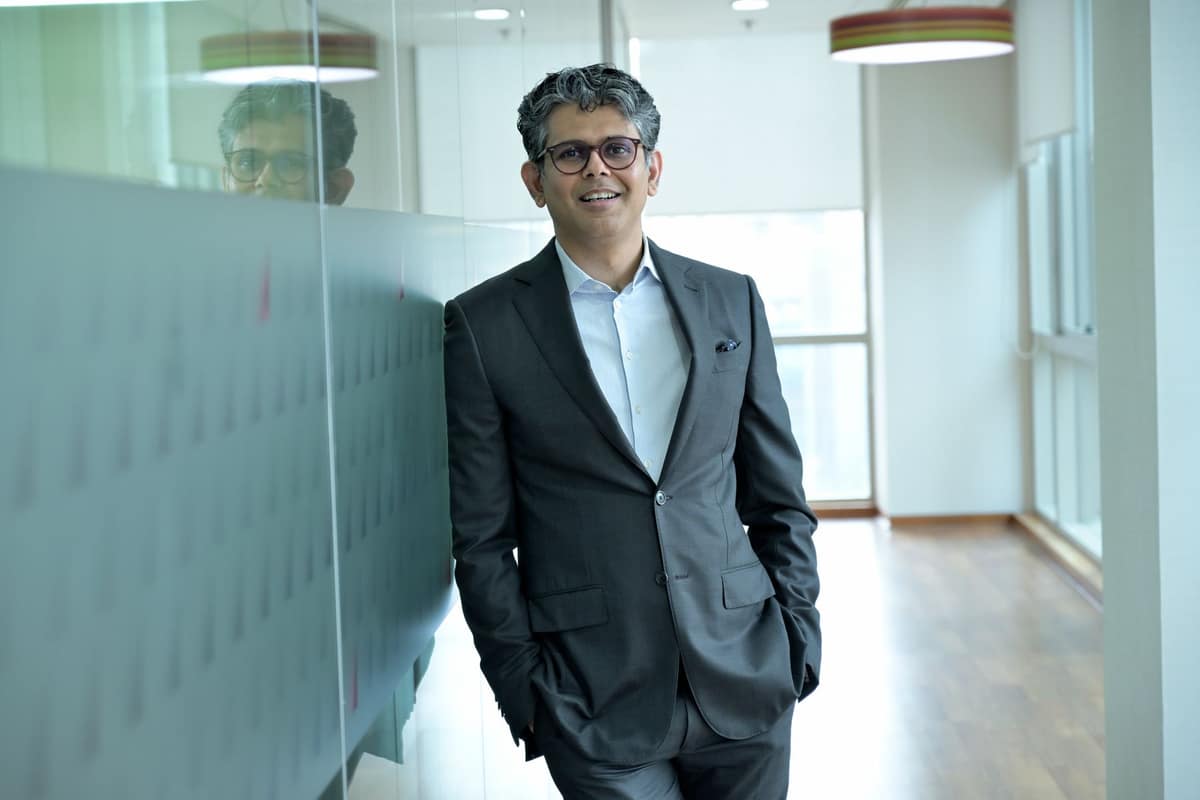 Business leader in a suit in a modern office corridor