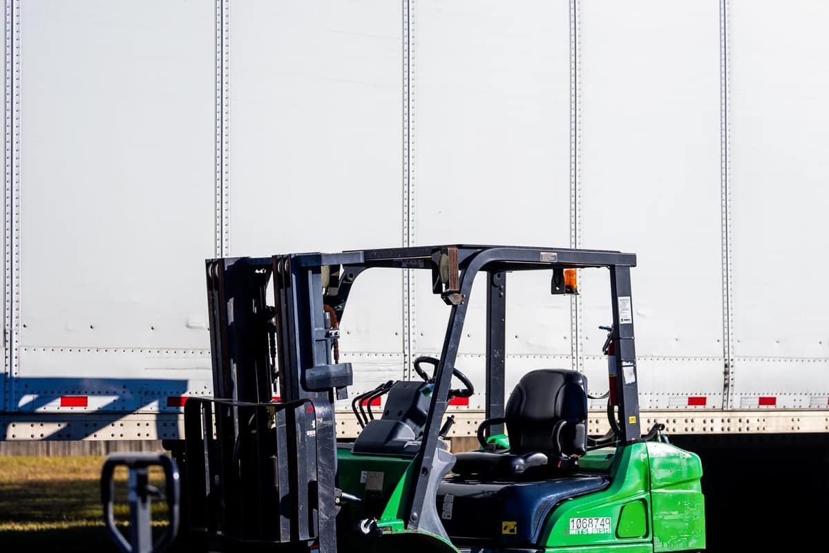 Forklift next to a truck at a loading dock