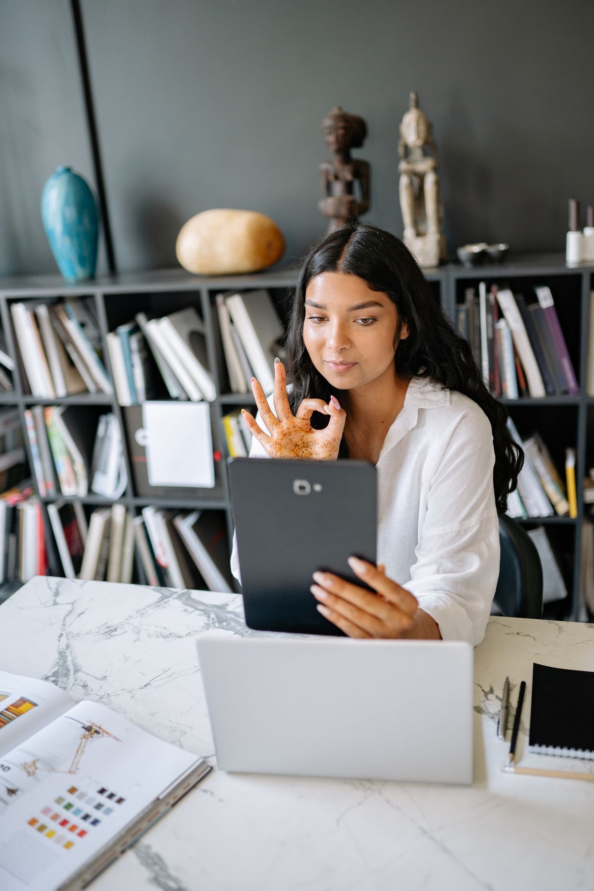 Woman using a tablet to open an employee self-service portal