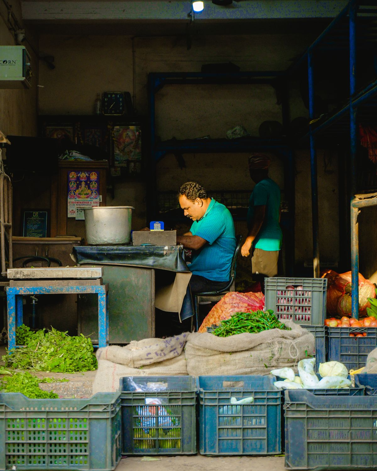 Small trader working at his market stall