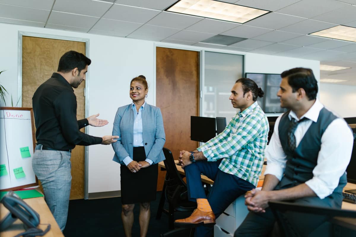 Directors and managers in discussion in an Indian office