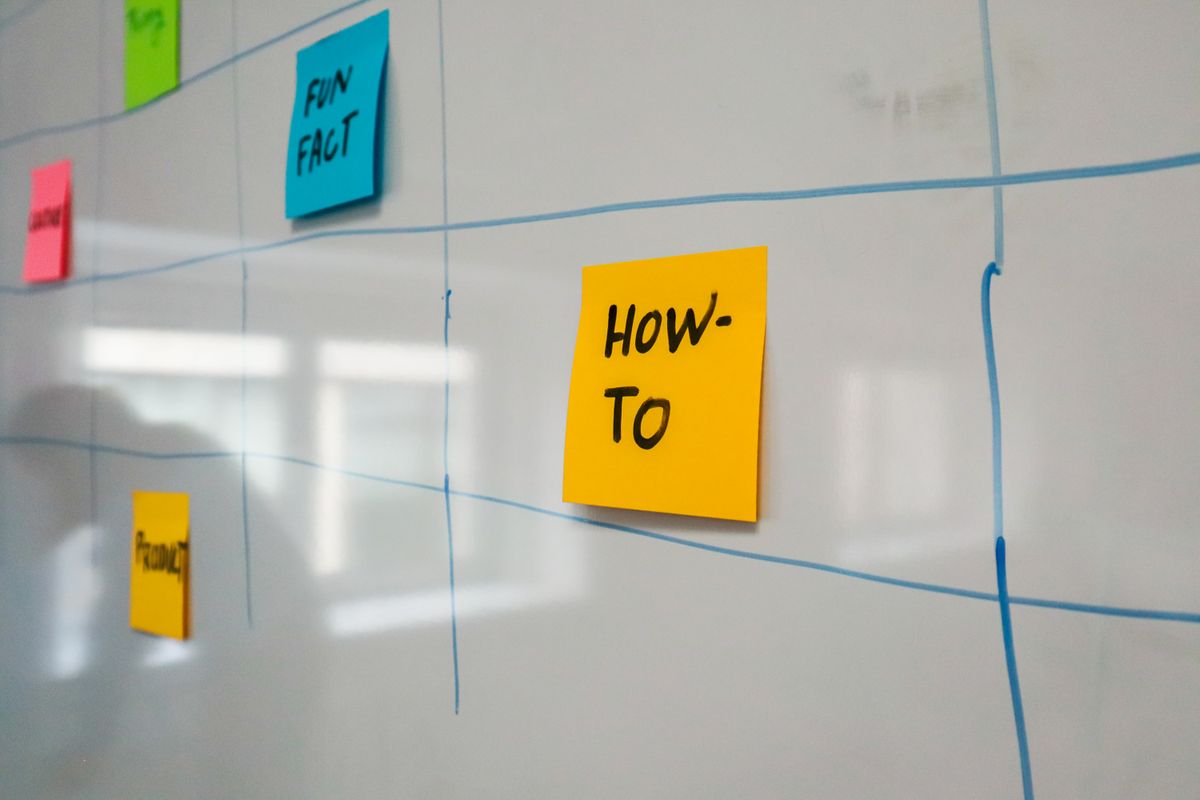 Sticky notes on a whiteboard planning a software rollout