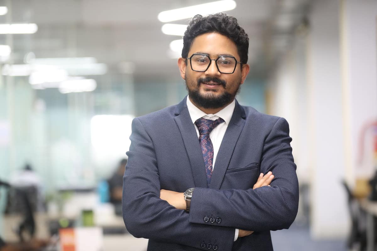 Confident Indian finance professional in a modern office