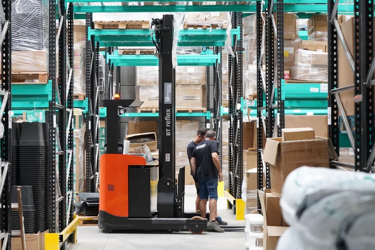 Modern warehouse with racks and a reach truck