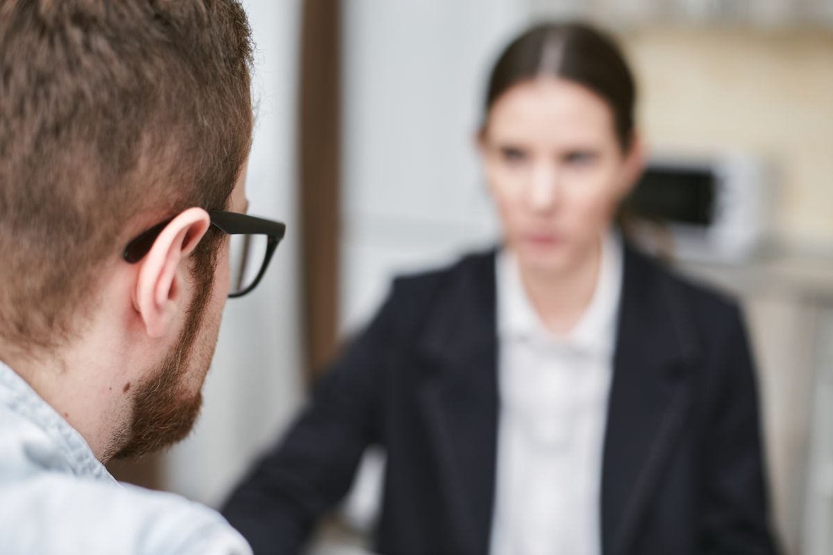 Business professionals discussing in a modern office setting.