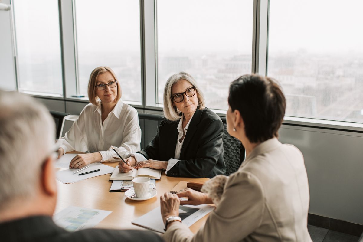 Business professionals engaged in a strategy meeting in a contemporary office.