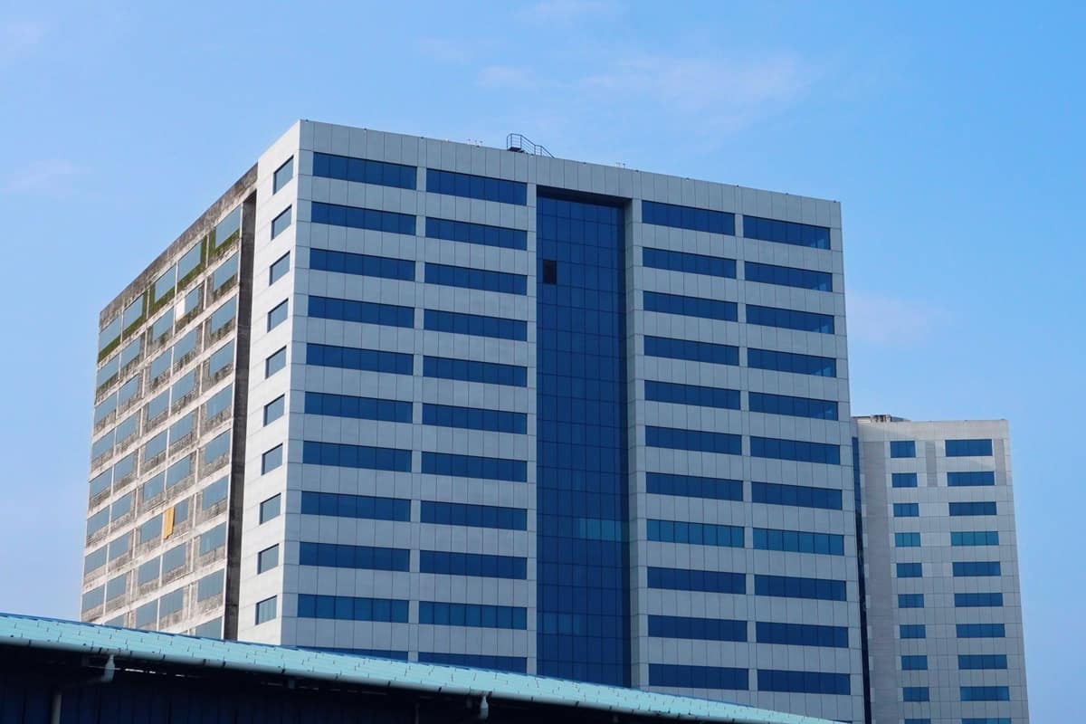 Modern corporate office building against a blue sky