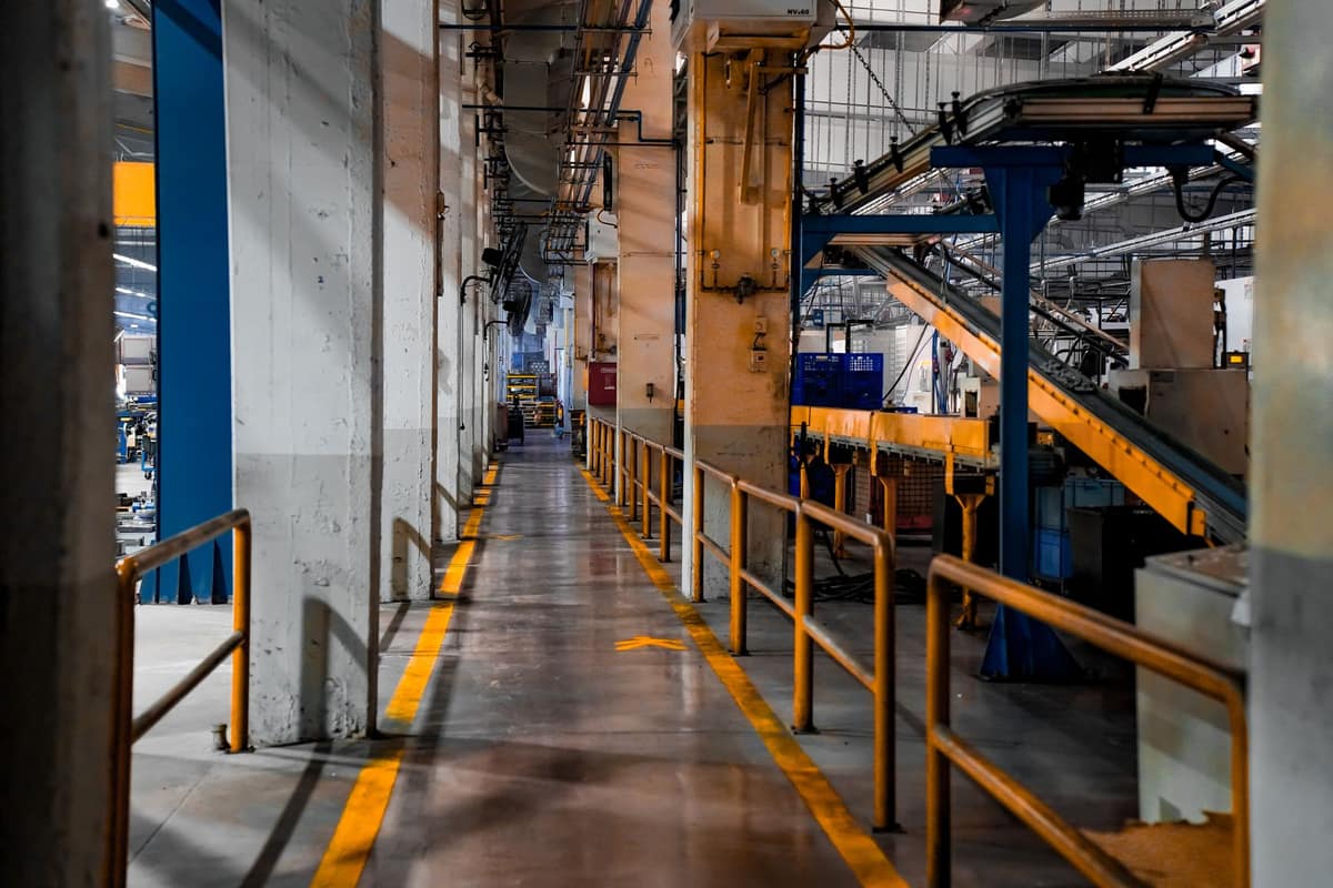 Long aisle inside a large modern manufacturing plant