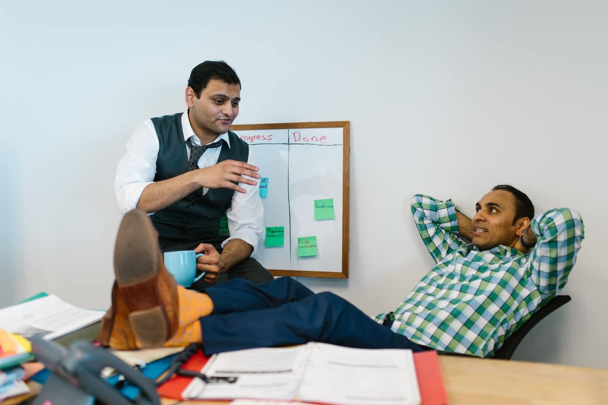 Two Indian business partners discussing plans in their office