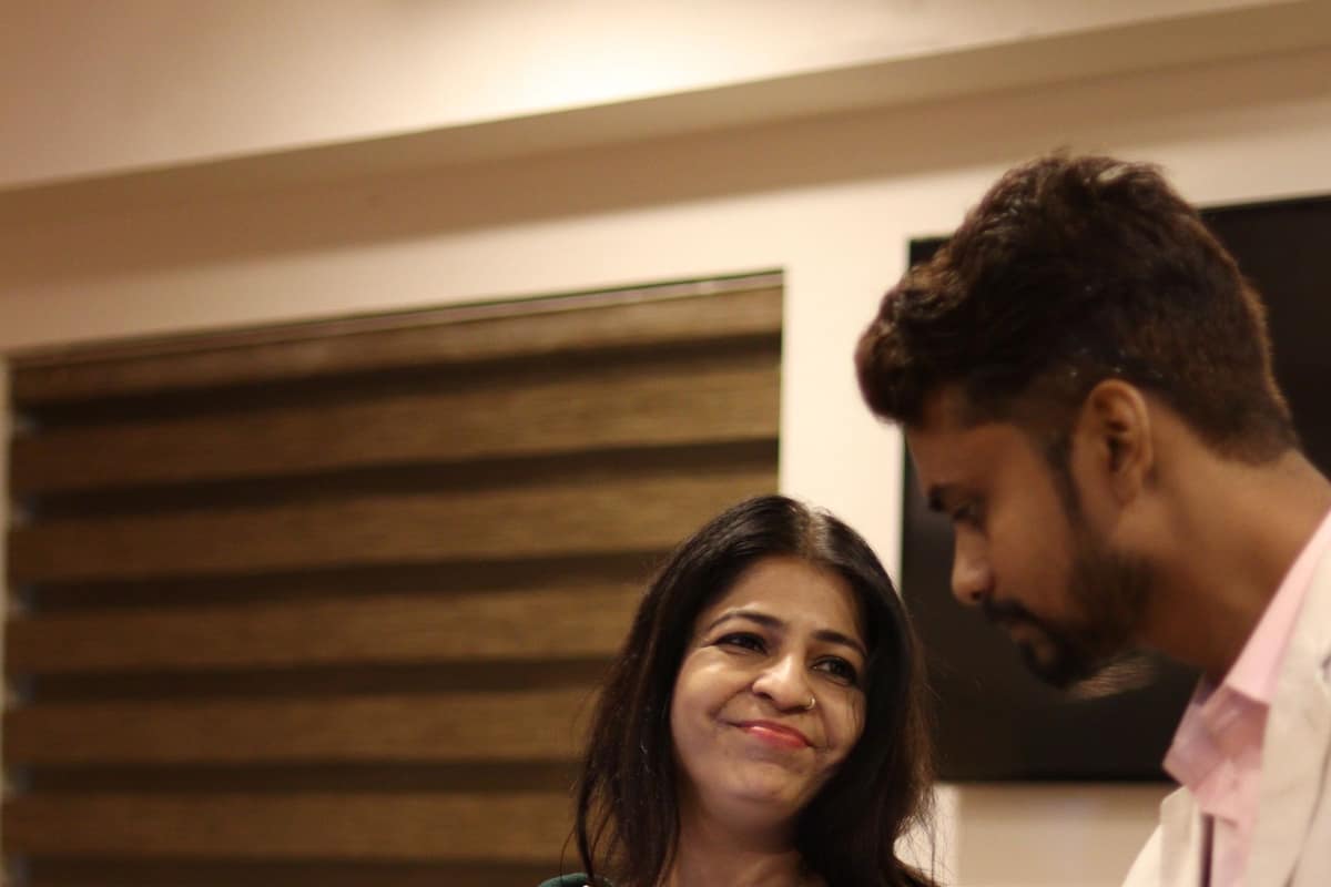 Colleagues reviewing work together in an Ahmedabad corporate office